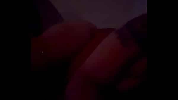 Rubbing her titties in sexy red lingerie